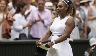 United States&#39; Serena Williams holds her second place trophy after losing to Romania&#39;s Simona Halep in the women&#39;s singles final match on day twelve of the Wimbledon Tennis Championships in London, Saturday, July 13, 2019. Halep defected Williams 6-2/6-2. (AP Photo/Tim Ireland)