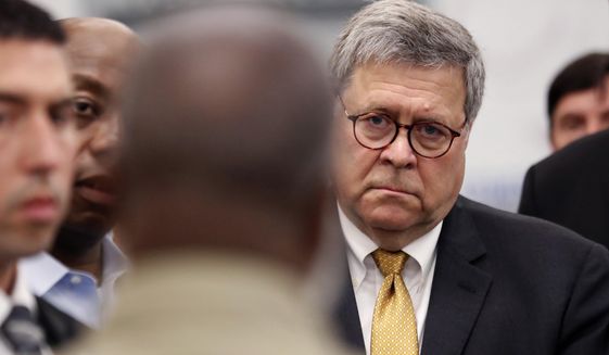 Attorney General William Barr listens as an inmate talks about the First Step Back program during a tour of a federal prison Monday, July 8, 2019, in Edgefield, S.C., in this file photo. (AP Photo/John Bazemore) **FILE**