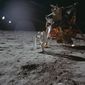 In this July 20, 1969 photo made available by NASA, Apollo 11 astronaut Buzz Aldrin works on a solar wind experiment device on the surface of the moon. (Neil Armstrong/NASA via AP)