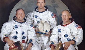 This March 30, 1969 photo made available by NASA shows the crew of the Apollo 11, from left, Neil Armstrong, commander; Michael Collins, module pilot; Edwin E. &amp;quot;Buzz&amp;quot; Aldrin, lunar module pilot. Apollo 11 was the first manned mission to the surface of the moon. (NASA via AP)