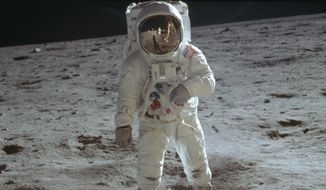 In this July 20, 1969, photo made available by NASA, astronaut Buzz Aldrin, lunar module pilot, walks on the surface of the moon during the Apollo 11 extravehicular activity. (Neil Armstrong/NASA via AP)