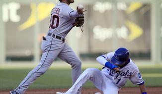 Detroit Tigers second baseman Harold Castro (30) turns a double play after forcing out Kansas City Royals&#39; Nicky Lopez (1) during the fifth inning of a baseball game at Kauffman Stadium in Kansas City, Mo., Saturday, July 13, 2019. Martin Maldonado was out at first. (AP Photo/Orlin Wagner)
