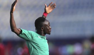 Senegal&#x27;s Sadio Mane applauds fans prior to the start of the African Cup of Nations semifinal soccer match between Senegal and Tunisia in 30 June stadium in Cairo, Egypt, Sunday, July 14, 2019. (AP Photo/Hassan Ammar)