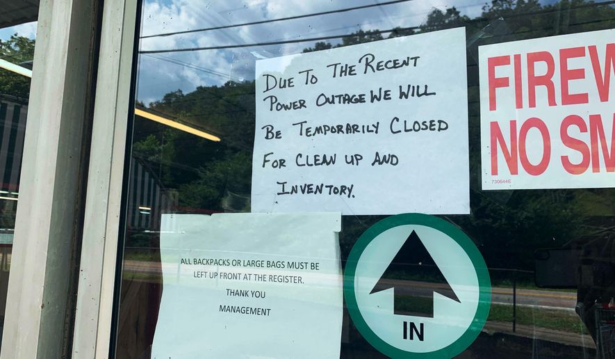 Clay IGA, the only major grocery store in Clay County, W.Va., closed June 24. 2019, without warning. A sign on the door informs customers of the closure. Though the sign says the store is temporarily closed, it has remained shuttered since June 24. The owner declined to say whether the store would reopen. (Amelia Ferrell Knisely/Charleston Gazette-Mail via AP)
