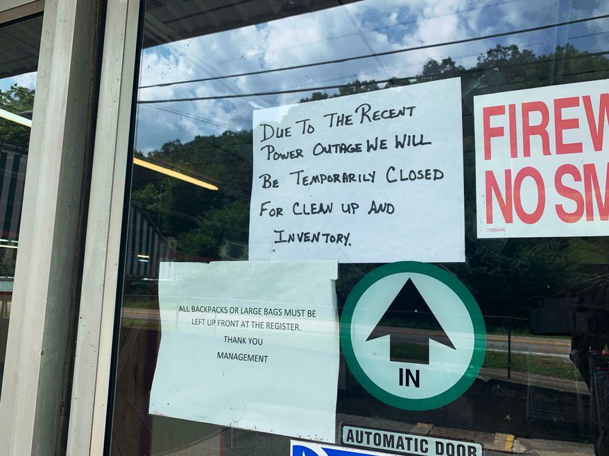 Clay IGA, the only major grocery store in Clay County, W.Va., closed June 24. 2019, without warning. A sign on the door informs customers of the closure. Though the sign says the store is temporarily closed, it has remained shuttered since June 24. The owner declined to say whether the store would reopen. (Amelia Ferrell Knisely/Charleston Gazette-Mail via AP)