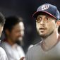 Washington Nationals starting pitcher Max Scherzer walks through the dugout during the ninth inning of a baseball game against the Miami Marlins, Tuesday, June 25, 2019, in Miami. The Nationals defeated the Marlins 6-1. (AP Photo/Wilfredo Lee)