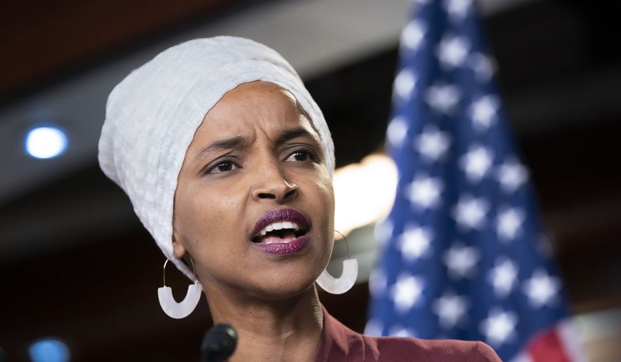 Rep. Ilhan Omar, D-Minn., respond to remarks by President Donald Trump after his call for the four Democratic congresswomen to go back to their &quot;broken&quot; countries, during a news conference at the Capitol in Washington, Monday, July 15, 2019. (AP Photo/J. Scott Applewhite) ** FILE **