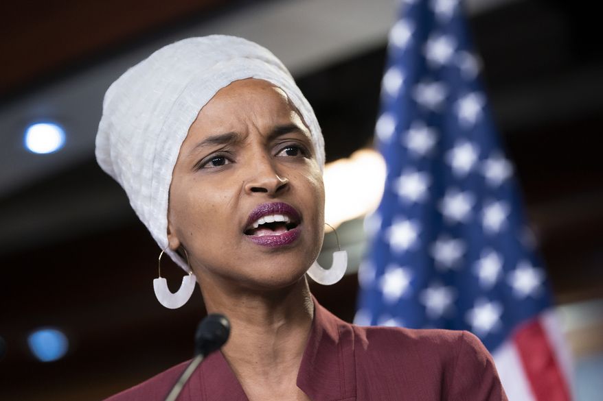Rep. Ilhan Omar, D-Minn., respond to remarks by President Donald Trump after his call for the four Democratic congresswomen to go back to their &quot;broken&quot; countries, during a news conference at the Capitol in Washington, Monday, July 15, 2019. (AP Photo/J. Scott Applewhite) ** FILE **