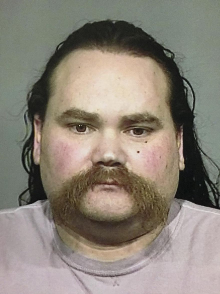FILE - This undated file photo released by the Sonoma County Sheriff's Office shows Shaun Michael Gallon. The Press Democrat reports that on Monday, July 15, 2019, Gallon had been sentenced to life in prison for killing an engaged couple from Ohio while they were camping on a Northern California beach in 2004. (Sonoma County Sheriff's Office via AP, File)