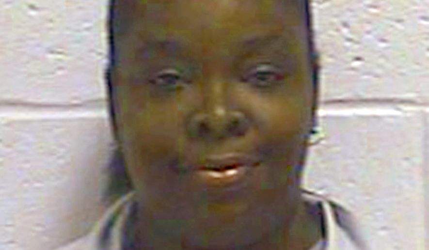 FILE - This undated file photo provided by the Oklahoma Department of Corrections shows Tondalao Hall. The Oklahoma Pardon and Parole Board has voted to advance its review of Hall's request for commutation of her 30-year prison sentence for failing to protect her children from abuse, The Oklahoman reports the board took the action Monday, July 15, 2019. (Oklahoma Department of Corrections via AP, File)
