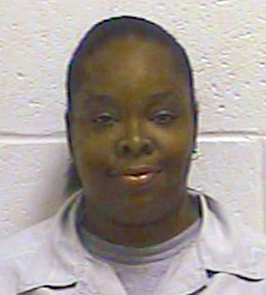 FILE - This undated file photo provided by the Oklahoma Department of Corrections shows Tondalao Hall. The Oklahoma Pardon and Parole Board has voted to advance its review of Hall's request for commutation of her 30-year prison sentence for failing to protect her children from abuse, The Oklahoman reports the board took the action Monday, July 15, 2019. (Oklahoma Department of Corrections via AP, File)