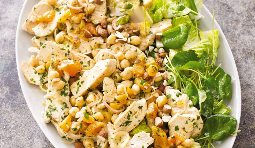 This undated photo provided by America's Test Kitchen in July 2019 shows Moroccan Chicken Salad with Apricots and Almonds in Brookline, Mass. This recipe appears in “The Complete Make-Ahead Cookbook.” (Carl Tremblay/America's Test Kitchen via AP)