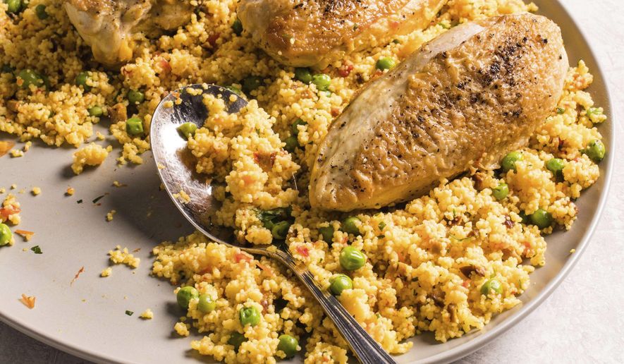 This undated photo provided by America's Test Kitchen in July 2019 shows Spanish-Style Chicken and Couscous in Brookline, Mass. This recipe appears in the cookbook "Multicooker Perfection." (Carl Tremblay/America's Test Kitchen via AP)