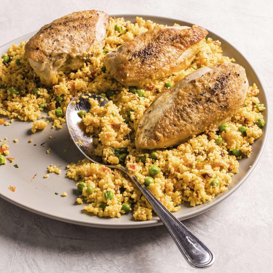 This undated photo provided by America's Test Kitchen in July 2019 shows Spanish-Style Chicken and Couscous in Brookline, Mass. This recipe appears in the cookbook "Multicooker Perfection." (Carl Tremblay/America's Test Kitchen via AP)