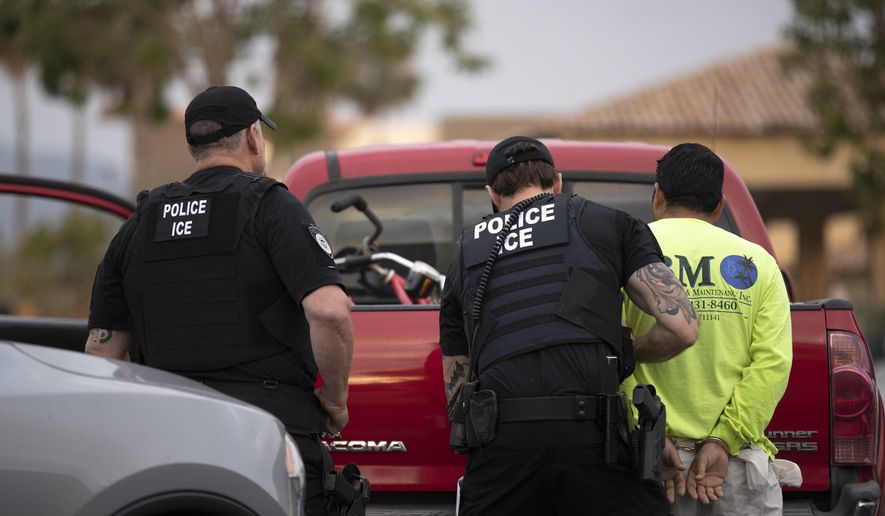 In this July 8, 2019, photo, a U.S. Immigration and Customs Enforcement (ICE) officers detain a man during an operation in Escondido, Calif. The carefully orchestrated arrest last week in this San Diego suburb illustrates how President Donald Trump&#x27;s pledge to start deporting millions of people in the country illegally is virtually impossible with ICE&#x27;s budget and its method of picking people up. (AP Photo/Gregory Bull) **FILE**