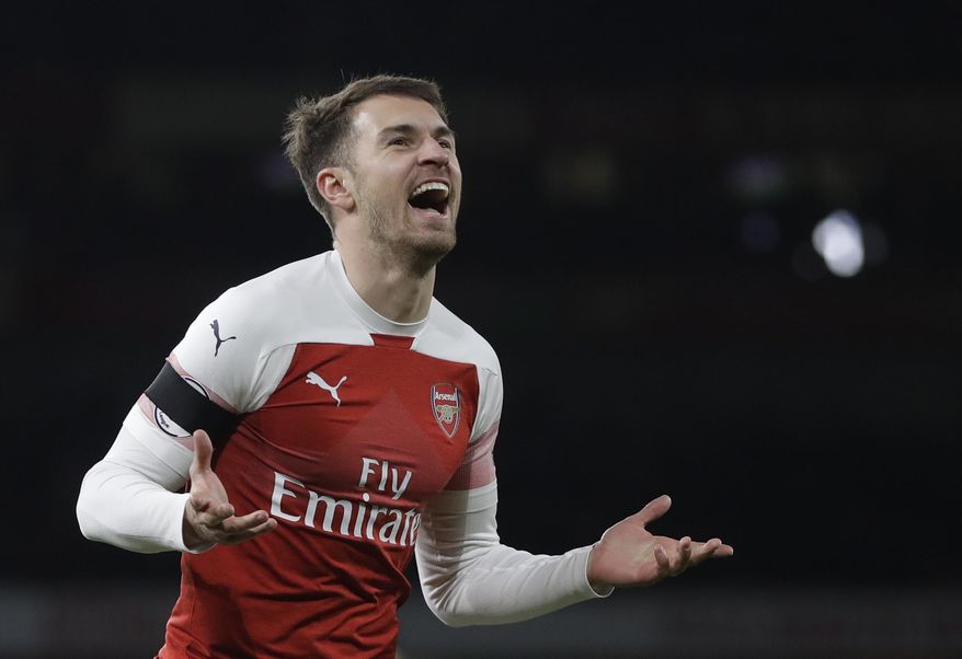 FILE - In this Tuesday, Jan. 1, 2019 file photo, Arsenal's Aaron Ramsey celebrates after scoring his side's third goal during the English Premier League soccer match between Arsenal and Fulham at Emirates stadium in London. Aaron Ramsey could play his first match for Juventus against a familiar foe if he recovers from injury in time. Ramsey joined Juventus this month on a four-year contract after leaving Arsenal. (AP Photo/Kirsty Wigglesworth, File)