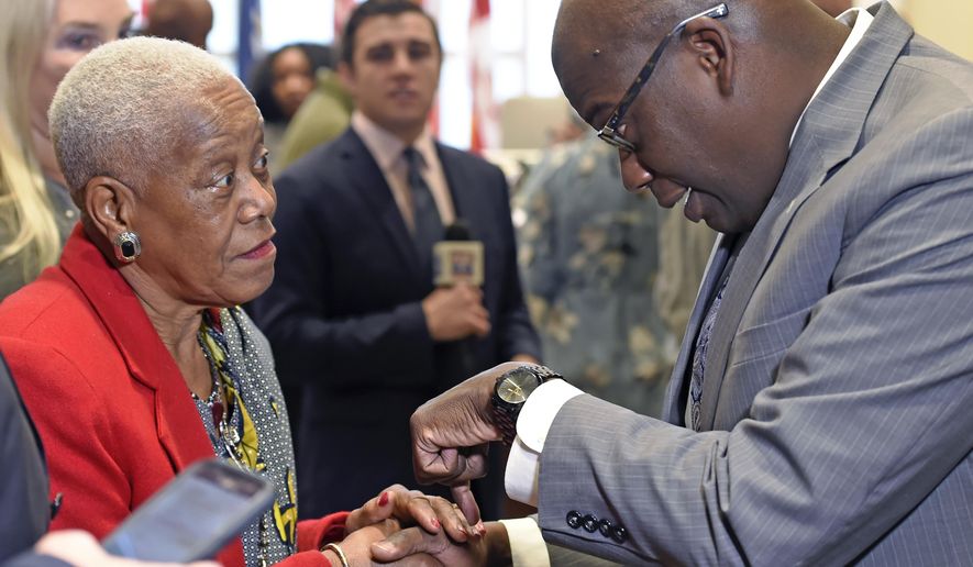 In a Friday Dec. 29, 2017 photo, Sadie Roberts-Joseph, left, chats with Louisiana State Police Lt. Col. Murphy Paul, right, who was appointed as the new Chief of Police for the Baton Rouge Police Department by Mayor-President Sharon Weston Broome, in Baton Rouge, La. East Baton Rouge Coroner Beau Clark released preliminary autopsy results Monday, July 15, 2019 that show Sadie Roberts-Joseph was suffocated to death before her body was found in the trunk of a car on July 9. (Bill Fei/The Advocate via AP)