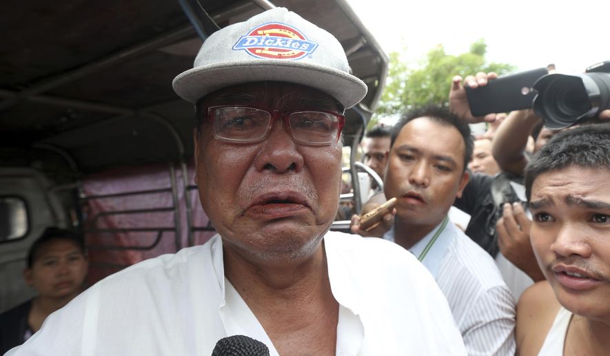 Mya Thein, father of rape suspect Aung Gyi, talks to journalists during the court appearance of his son Monday, July 15, 2019, in Nyapyitaw, Myanmar. A court in Myanmar has begun proceedings against a suspect in the rape of a 2-year-old girl at her nursery school that has generated huge public outcry. (AP Photo/Aung Shine Oo)