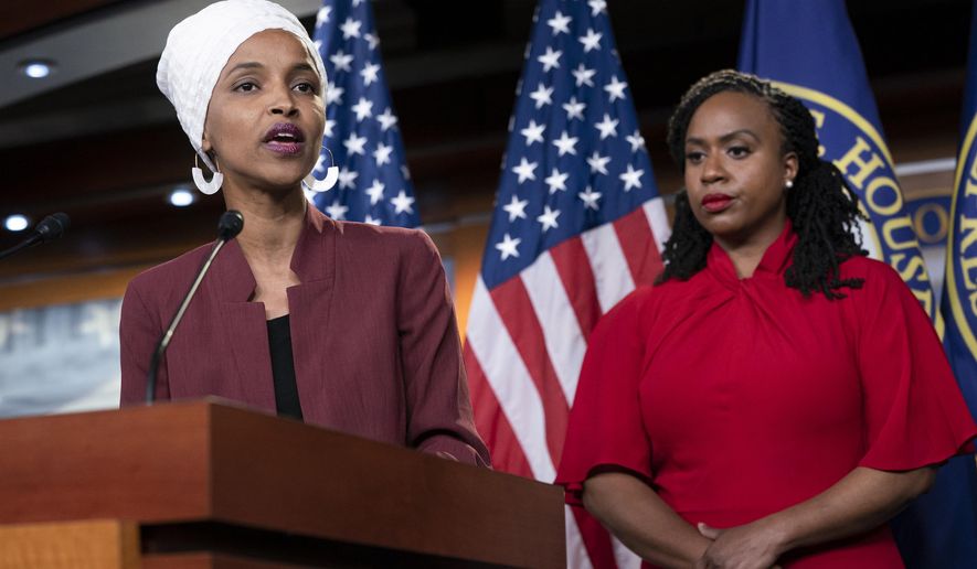 U.S. Rep. Ilhan Omar, D-Minn., joined at right by U.S. Rep. Ayanna Pressley, D-Mass., responds to remarks by President Donald Trump after he called for four Democratic congresswomen of color to go back to their "broken" countries, as he exploited the nation's glaring racial divisions once again for political gain, during a news conference at the Capitol in Washington, Monday, July 15, 2019. All four congresswomen are American citizens and three of the four were born in the U.S. Omar is the first Somali-American in Congress. (AP Photo/J. Scott Applewhite)