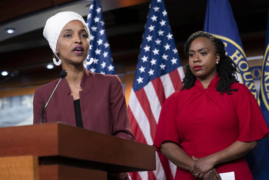 U.S. Rep. Ilhan Omar, D-Minn., joined at right by U.S. Rep. Ayanna Pressley, D-Mass., responds to remarks by President Donald Trump after he called for four Democratic congresswomen of color to go back to their "broken" countries, as he exploited the nation's glaring racial divisions once again for political gain, during a news conference at the Capitol in Washington, Monday, July 15, 2019. All four congresswomen are American citizens and three of the four were born in the U.S. Omar is the first Somali-American in Congress. (AP Photo/J. Scott Applewhite)
