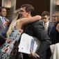Secretary of the Army and Secretary of Defense nominee Mark Esper gets a hug from his daughter Kate Esper, as his Senate Armed Services Committee confirmation hearing concludes on Capitol Hill in Washington, Tuesday, July 16, 2019. Esper&#39;s wife Leah Esper, back right, and son John Esper, watch. (AP Photo/Manuel Balce Ceneta)