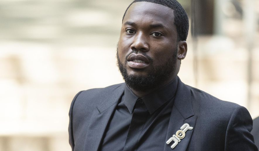 Rapper Meek Mill arrives at a Pennsylvania appeals court in Philadelphia, Tuesday, July 16, 2019. Lawyers for Mill will ask an appeals court Tuesday to overturn a 2008 drug and gun conviction that has kept the rapper on probation for a decade and made him a celebrity crusader for criminal justice reform. (AP Photo/Matt Rourke)