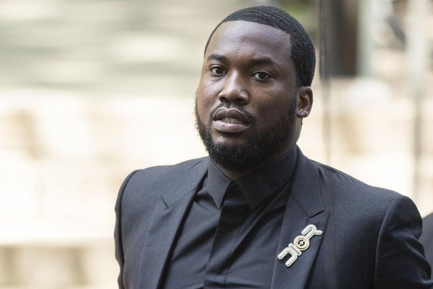 Rapper Meek Mill arrives at a Pennsylvania appeals court in Philadelphia, Tuesday, July 16, 2019. Lawyers for Mill will ask an appeals court Tuesday to overturn a 2008 drug and gun conviction that has kept the rapper on probation for a decade and made him a celebrity crusader for criminal justice reform. (AP Photo/Matt Rourke)