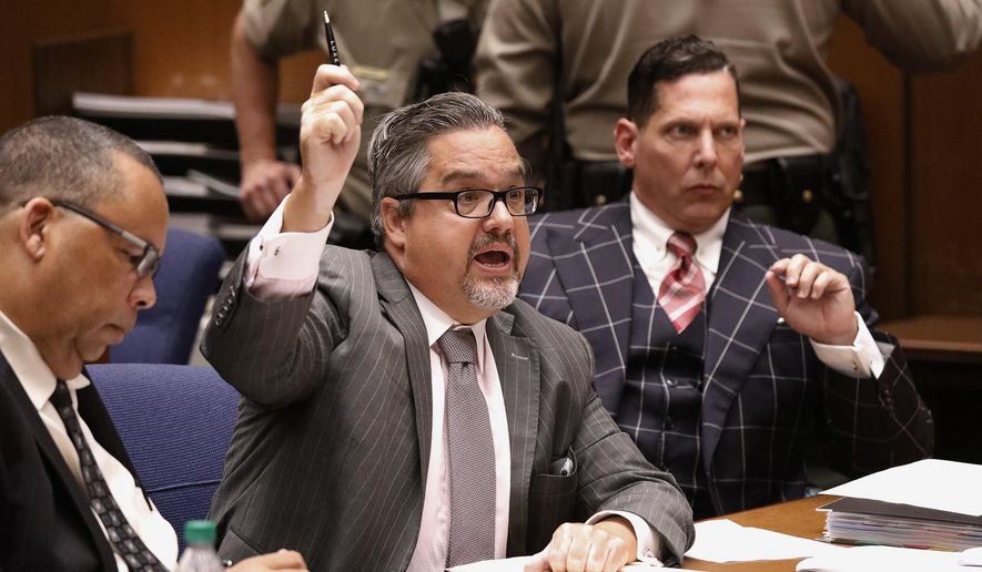 Attorneys Allen Sawyer, center, and Ken Rosenfeld, right, for Naason Joaquin Garcia, the leader of a Mexico-based evangelical church with a worldwide membership, attend a bail review hearing for Garcia in Los Angeles Superior Court on Monday, July 15, 2019. Prosecutors have asked a judge to hold Garcia without bail on charges of child rape and human trafficking. (Al Seib/Los Angeles Times via AP, Pool)