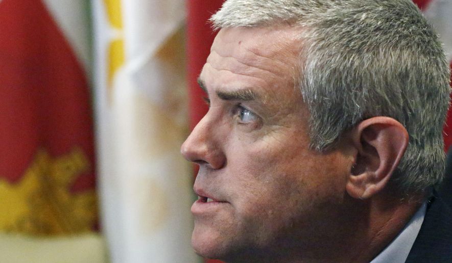 FILE - In this March 28, 2019 file photo, House Speaker Philip Gunn, R-Clinton, speaks with reporters at the Capitol in Jackson, Miss. Gunn, and the state's top elections official, Secretary of State Delbert Hosemann, also a Republican, are defendants in a lawsuit that challenges the state's system of choosing a governor. The lawsuit was filed by four black plaintiffs with backing by former U.S. Attorney General Eric Holder. Attorneys defending Mississippi say the lawsuit is about "partisan politics," not about protecting African Americans' voting rights. (AP Photo/Rogelio V. Solis, File)