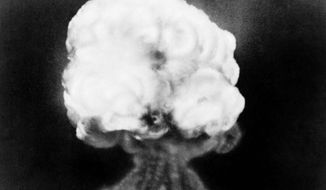 FILE - This July 16, 1945, file photo, shows the mushroom cloud of the first atomic explosion at Trinity Test Site near Alamagordo, N.M. A compensation program for those exposed to radiation from years of nuclear weapons testing and uranium mining would be expanded under legislation that seeks to address fallout across the western United States, Guam and the Northern Mariana Islands. (AP Photo/File)