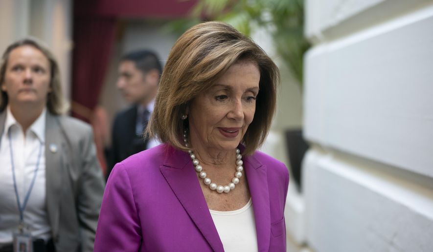 House Speaker Nancy Pelosi, D-Calif., arrives for a closed-door session with her caucus before a vote on a resolution condemning what she called &amp;quot;racist comments&amp;quot; by President Donald Trump at the Capitol in Washington, Tuesday, July 16, 2019. His remarks were directed at Reps. Ilhan Omar of Minnesota, Alexandria Ocasio-Cortez of New York, Ayanna Pressley of Massachusetts and Rashida Tlaib of Michigan. (AP Photo/J. Scott Applewhite)