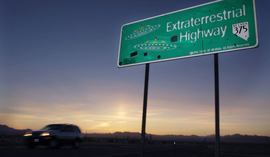 FILE - In this April 10, 2002, file photo, a vehicle moves along the Extraterrestrial Highway near Rachel, Nev., the closest town to Area 51. The U.S. Air Force has warned people against participating in an internet joke suggesting a large crowd of people "storm Area 51," the top-secret Cold War test site in the Nevada desert. (AP Photo/Laura Rauch, File)