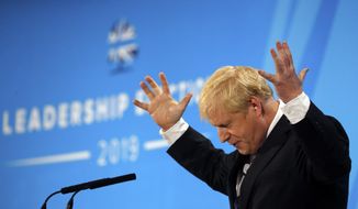 Conservative party leadership candidate Boris Johnson gestures while delivering his speech during a Conservative leadership hustings at ExCel Centre in London, Wednesday, July 17, 2019. The two contenders, Jeremy Hunt and Boris Johnson are competing for votes from party members, with the winner replacing Prime Minister Theresa May as party leader and Prime Minister of Britain&#39;s ruling Conservative Party. (AP Photo/Frank Augstein)