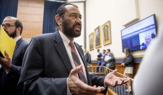 Rep. Al Green, D-Texas, right, speaks to visitors during a break from testimony from David Marcus, CEO of Facebook&#39;s Calibra digital wallet service, before a House Financial Services Committee hearing on Facebook&#39;s proposed cryptocurrency on Capitol Hill in Washington, Wednesday, July 17, 2019. Green has introduced a resolution in the House to impeach President Donald Trump. (AP Photo/Andrew Harnik)