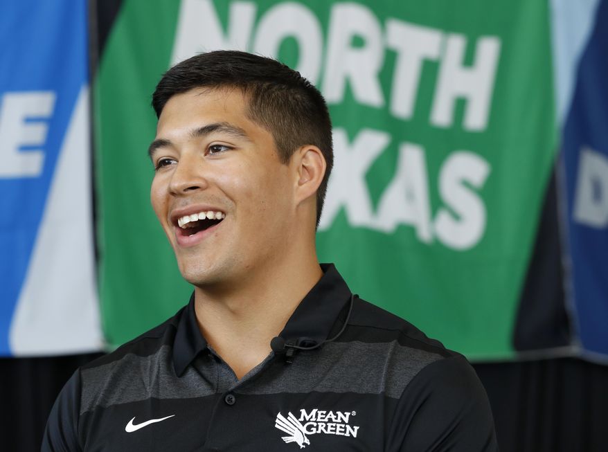 North Texas quarterback Mason Fine responds to questions in an interview during the Conference USA college football media day Wednesday, July 17, 2019, in Frisco, Texas. (AP Photo/Tony Gutierrez)