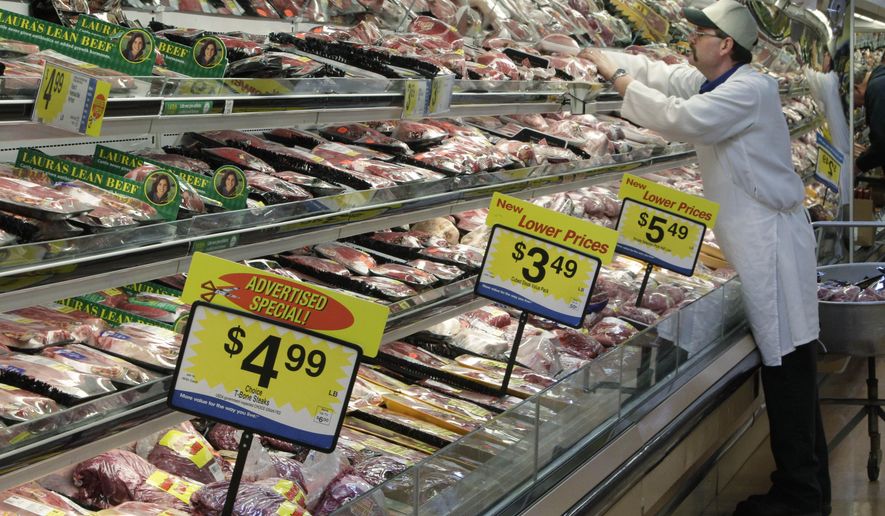 FILE - In this March 1, 2011, file photo, a worker stocks the fresh meat shelves at a Kroger Co. supermarket, in Cincinnati. The supermarket is one of the most important places to be shopping-savvy. The good news is that there are so many easy and effective way to slash your grocery budget. (AP Photo/Al Behrman, File)