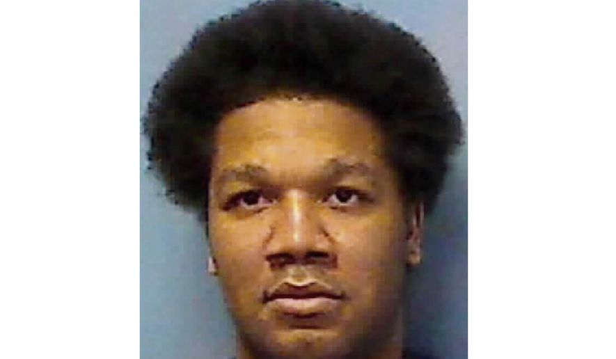 This undated photo provided by the Nevada Department of Corrections shows Julius Damiano Deangilo Trotter. Trotter, a convicted felon facing the death penalty in the robbery-killing of two Vietnamese tour leaders at a Las Vegas Strip hotel wants a judge to throw out his criminal indictment and set him free. Julius Trotter's attorney, Lisa Rasmussen, is due to argue Wednesday, July 17, 2019, that prosecutors withheld information that might have prevented a Clark County grand jury from indicting Trotter. (Nevada Department of Corrections via AP)