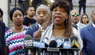 Gwen Carr, mother of chokehold victim Eric Garner, speaks outside the U.S. Attorney&#39;s office, in the Brooklyn borough of New York, Tuesday, July 16, 2019, as Rev. Al Sharpton listens, center.   Federal prosecutors won&#39;t bring civil rights charges against New York City police officer Daniel Pantaleo, in the 2014 chokehold death of Garner, a decision made by Attorney General William Barr and announced one day before the five-year anniversary of his death, officials said.  (AP Photo/Richard Drew)