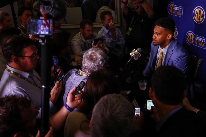Alabama quarterback Tua Tagovailoa speaks to reporters during the NCAA college football Southeastern Conference Media Days, Wednesday, July 17, 2019, in Hoover, Ala. (AP Photo/Butch Dill)