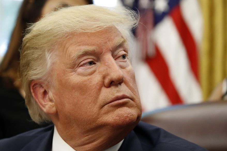 President Donald Trump listens as he meets with survivors of religious persecution in the Oval Office of the White House on Wednesday, July 17, 2019, in Washington. The survivors come from countries including, Myanmar, New Zealand, Yemen, China, Cuba, Eritrea, Nigeria, Turkey, Vietnam, Sudan, Iraq, Afghanistan, North Korea, Sri Lanka, Pakistan, Iran and Germany.(AP Photo/Alex Brandon)