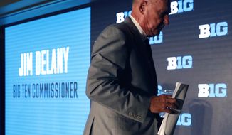 Big Ten Commissioner Jim Delany walks away from the podium at the Big Ten Conference NCAA college football media days Thursday, July 18, 2019, in Chicago. Delany will retire on Jan. 1, 2020, with Minnesota Vikings executive Kevin Warren succeeding him. (AP Photo/Charles Rex Arbogast)