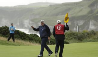 Northern Ireland&#39;s Darren Clarke acknowledges the crowd after getting a birdie on the 5th green during the first round of the British Open Golf Championships at Royal Portrush in Northern Ireland, Thursday, July 18, 2019.(AP Photo/Matt Dunham)