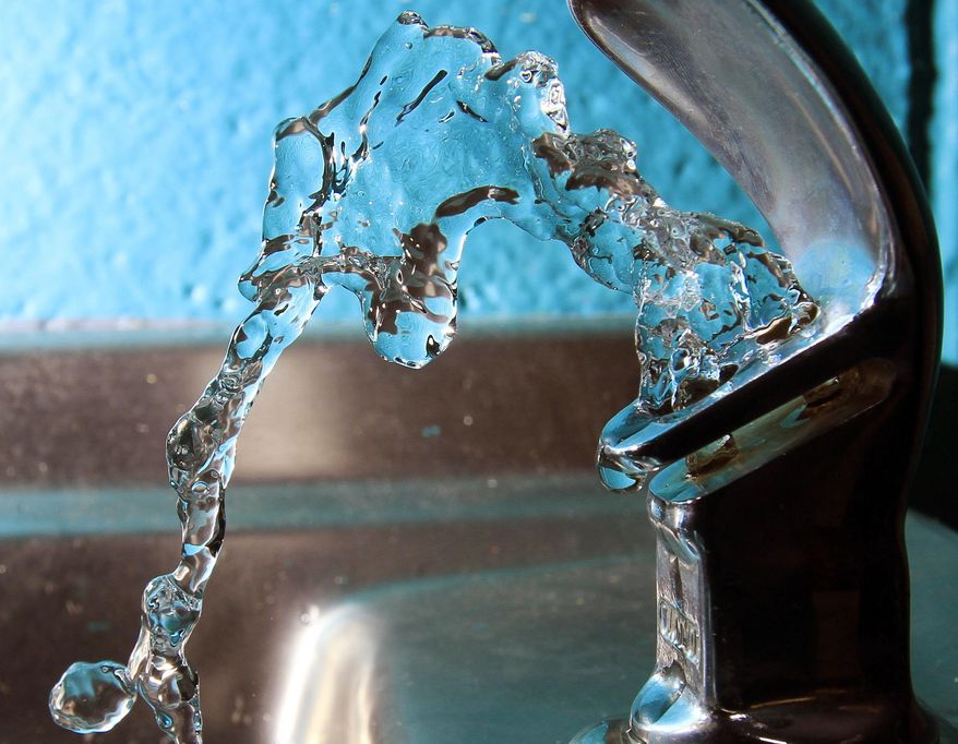 FILE - In this Friday Jan. 7, 2011 file photo, water flows from a water fountain in Concord, N.H. A New Hampshire legislative committee voted Thursday, July 18, 2019, to approve some of the nation's toughest drinking water standards for a class of toxic chemicals that have caused widespread contamination and sparked health concerns. (AP Photo/Jim Cole, File)
