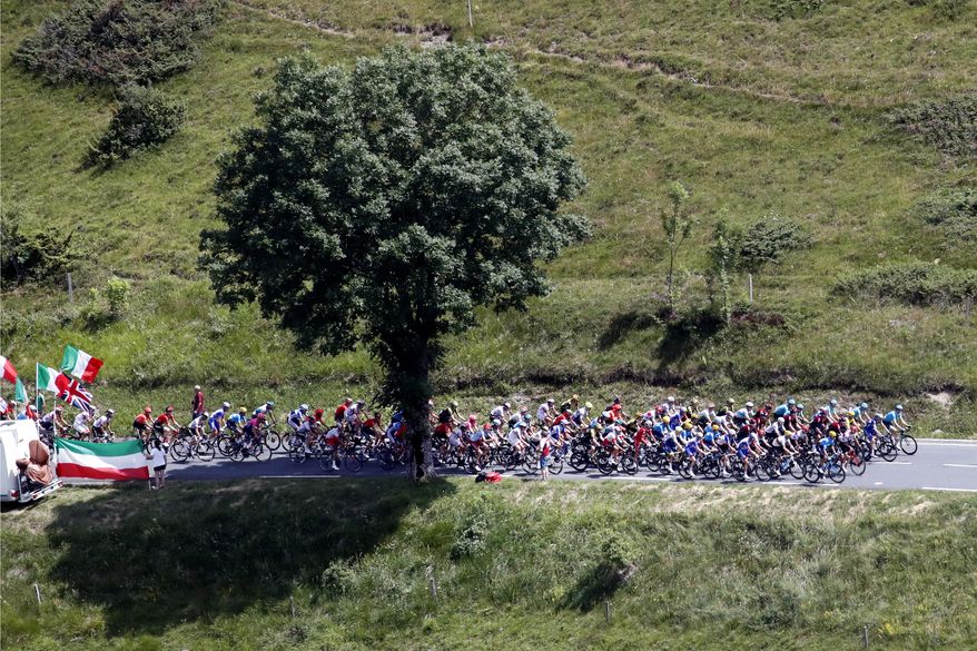 The pack rides during the twelfth stage of the Tour de France cycling race over 209,5 kilometers (130 miles) with start in Toulouse and finish in Bagneres-de-Bigorre, France, Thursday, July 18, 2019. (AP Photo/ Christophe Ena)
