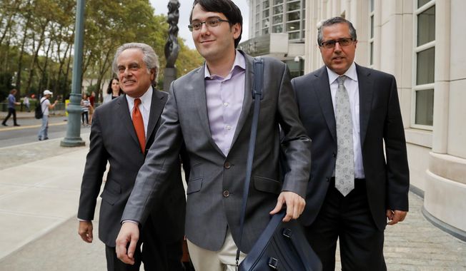 FILE - In this Thursday, July 27, 2017, file photo, Martin Shkreli, center, leaves federal court with his attorney Benjamin Brafman, left, in New York. A federal appeals court on Thursday, July 18, 2019 has upheld the securities fraud conviction against the former drug company CEO. (AP Photo/Julie Jacobson, File)