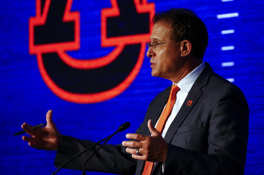 Auburn head coach Gus Malzahn speaks to reporters during the NCAA college football Southeastern Conference Media Days, Thursday, July 18, 2019, in Hoover, Ala. (AP Photo/Butch Dill)