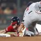 Atlanta Braves&#39; Josh Donaldson, left, is tagged out by Washington Nationals shortstop Trea Turner as he tries to steal second base in the seventh inning of a baseball game Friday, July 19, 2019, in Atlanta. (AP Photo/John Bazemore)