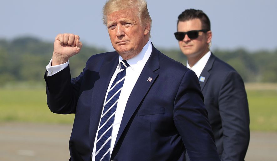 President Donald Trump waves as he walks from Air Force One upon arrival at Morristown Municipal Airport, in Morristown, N.J., Friday, July 19, 2019. (AP Photo/Manuel Balce Ceneta)