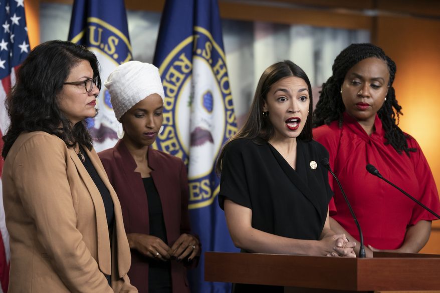 In this July 15, 2019, photo, Rep. Alexandria Ocasio-Cortez, D-N.Y., speaks as, from left, Rep. Rashida Tlaib, D-Mich., Rep. Ilhan Omar, D-Minn., and Rep. Ayanna Pressley, D-Mass., listen during a news conference at the Capitol in Washington. Long before President Donald Trump attacked the four Democratic congresswomen of color, saying they should “go back” to their home countries, they were targets of hateful rhetoric and disinformation online. (AP Photo/J. Scott Applewhite) ** FILE **