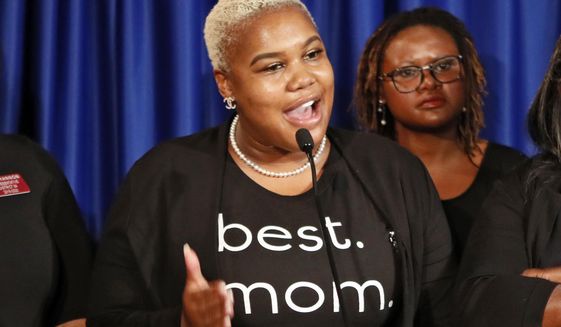In this May 7, 2019, file photo Rep. Erica Thomas, D-Austell, speaks during a news conference in Atlanta. Thomas says she was verbally attacked in a supermarket by a white man who told her, &amp;quot;Go back where you came from.&amp;quot; Rep. Erica Thomas of Austell tearfully described the confrontation in a Facebook video Friday, July 19, 2019. She acknowledged being in an express line with too many items but said she got in the line because she is nine months pregnant and cannot stand for long periods. (Bob Andres/Atlanta Journal-Constitution via AP)